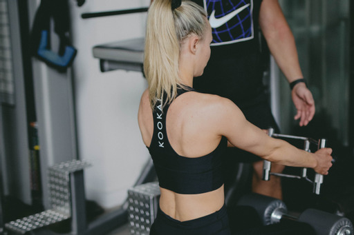 A client using strength-training equipment in the private gym